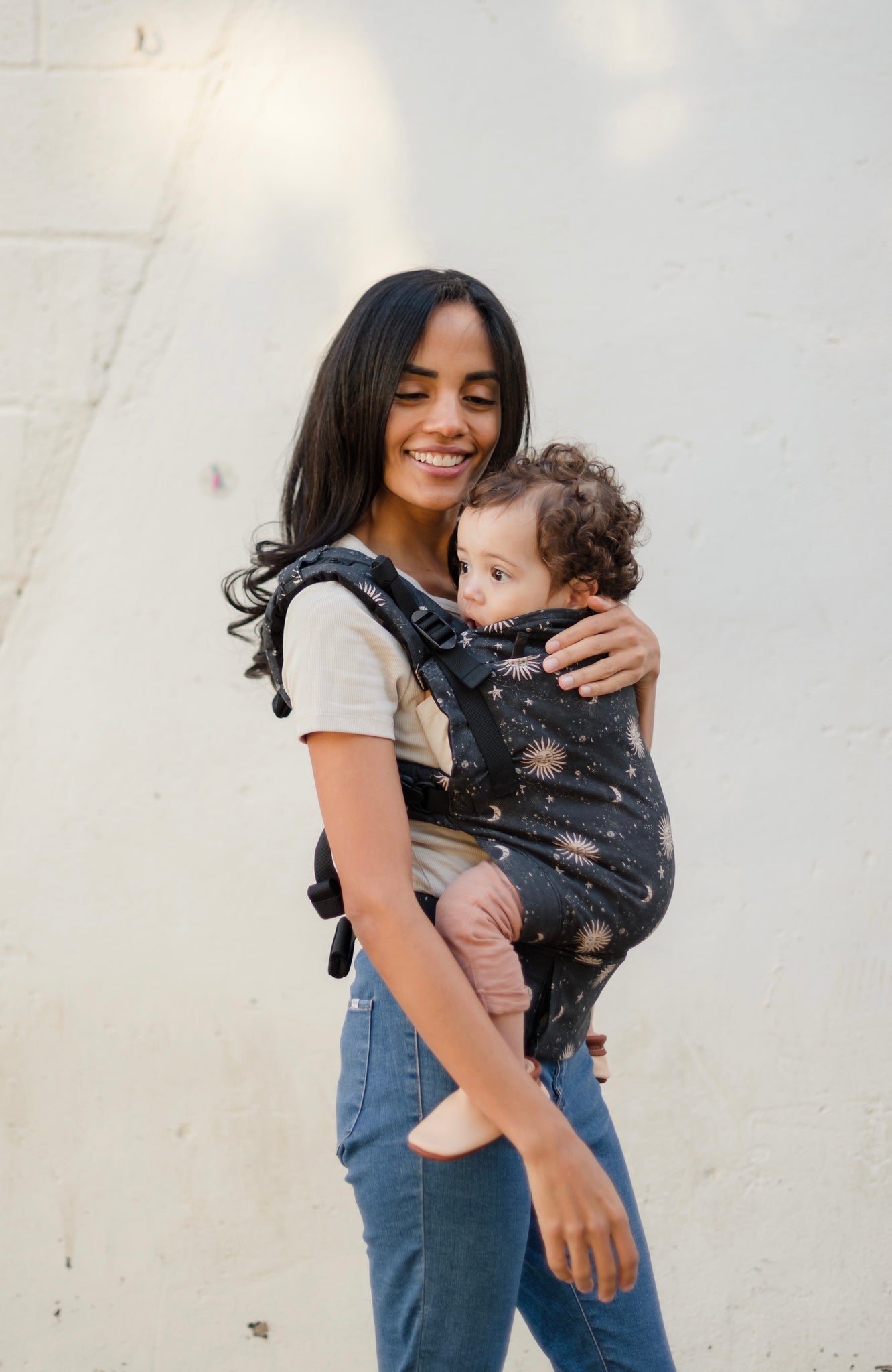 Introducing the Boba X - a versatile, adjustable baby carrier designed to last from birth to toddlerhood. Enjoy its softness, support, and adjustability, plus its beautiful celestial print on warm charcoal print. Shop now!